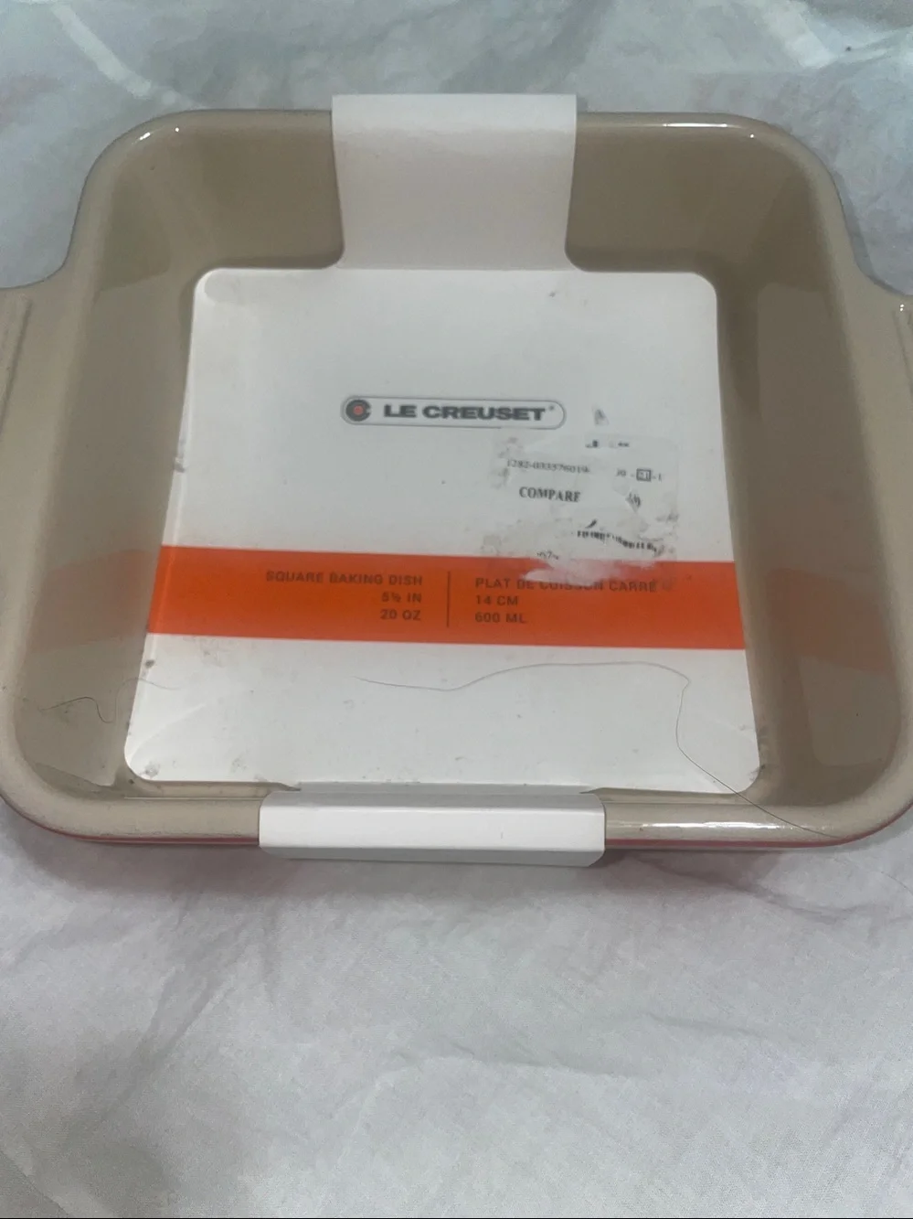 Brand New Le Creuset 5 1/2” square red baking dish that holds 20oz